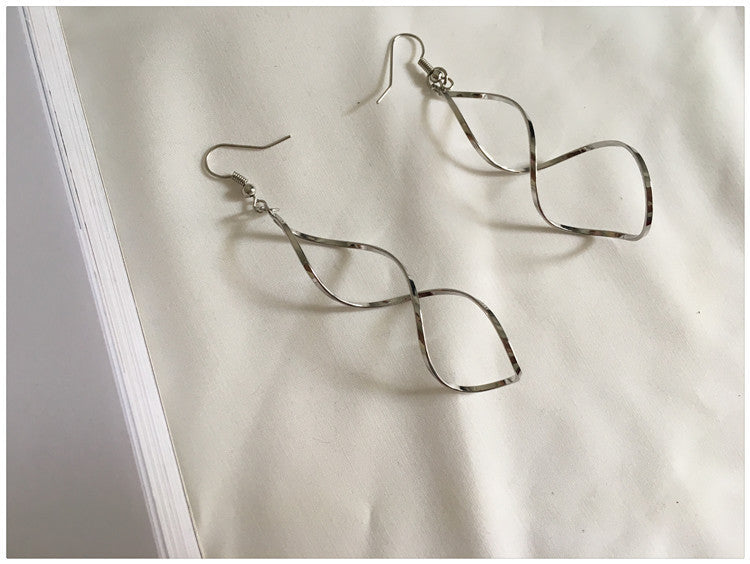 Wavy spiral cross curved earrings